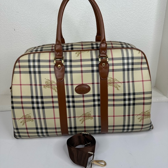 Burberry Handbags - Burberrys PVC vintage travel bag with unbranded strap